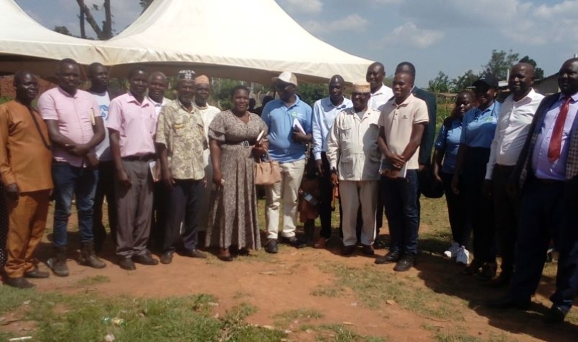 A group photograph capturing attendees after the official commissioning of the solar water supply system in Mitimito village.
